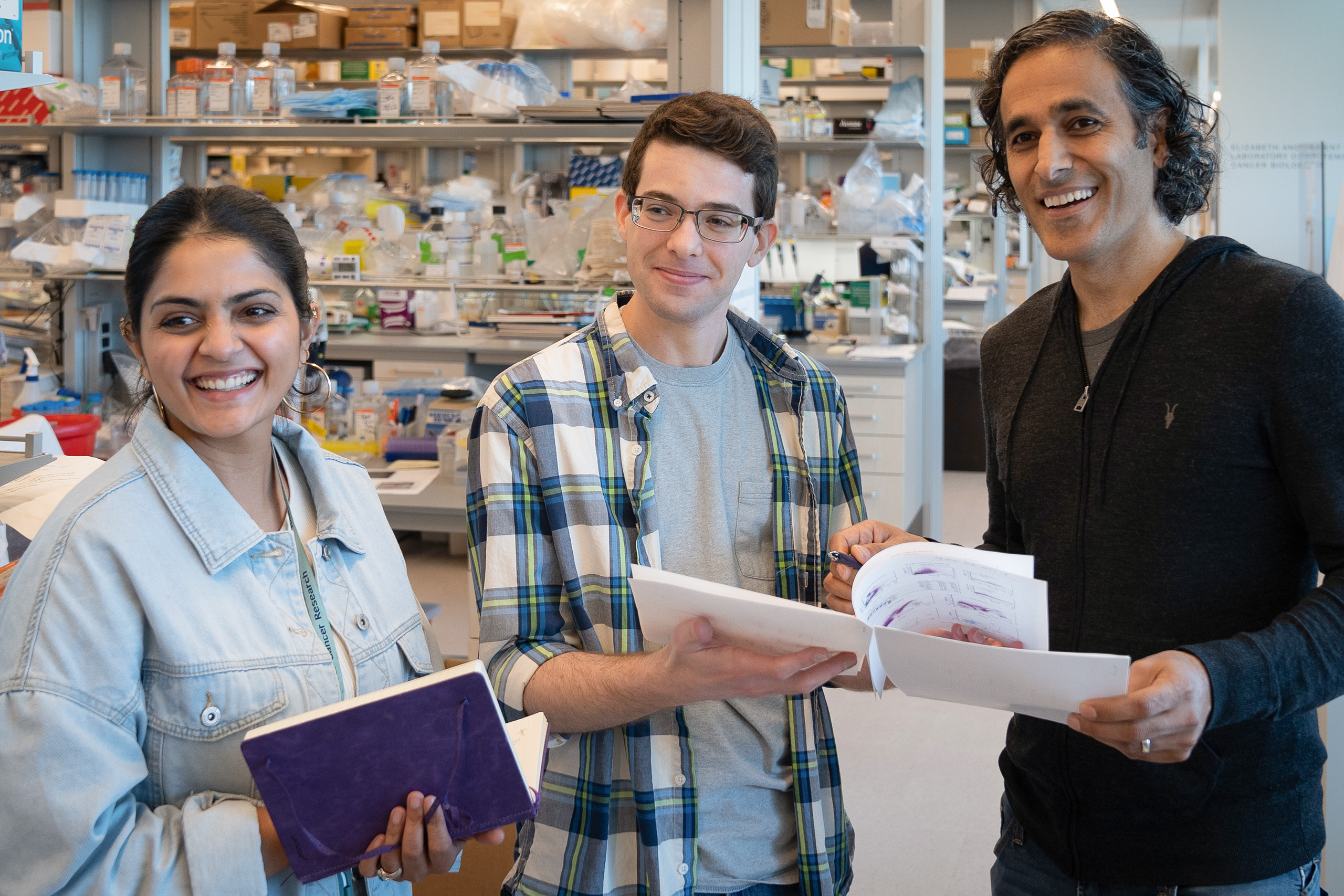 three scientists taking a break in the lab